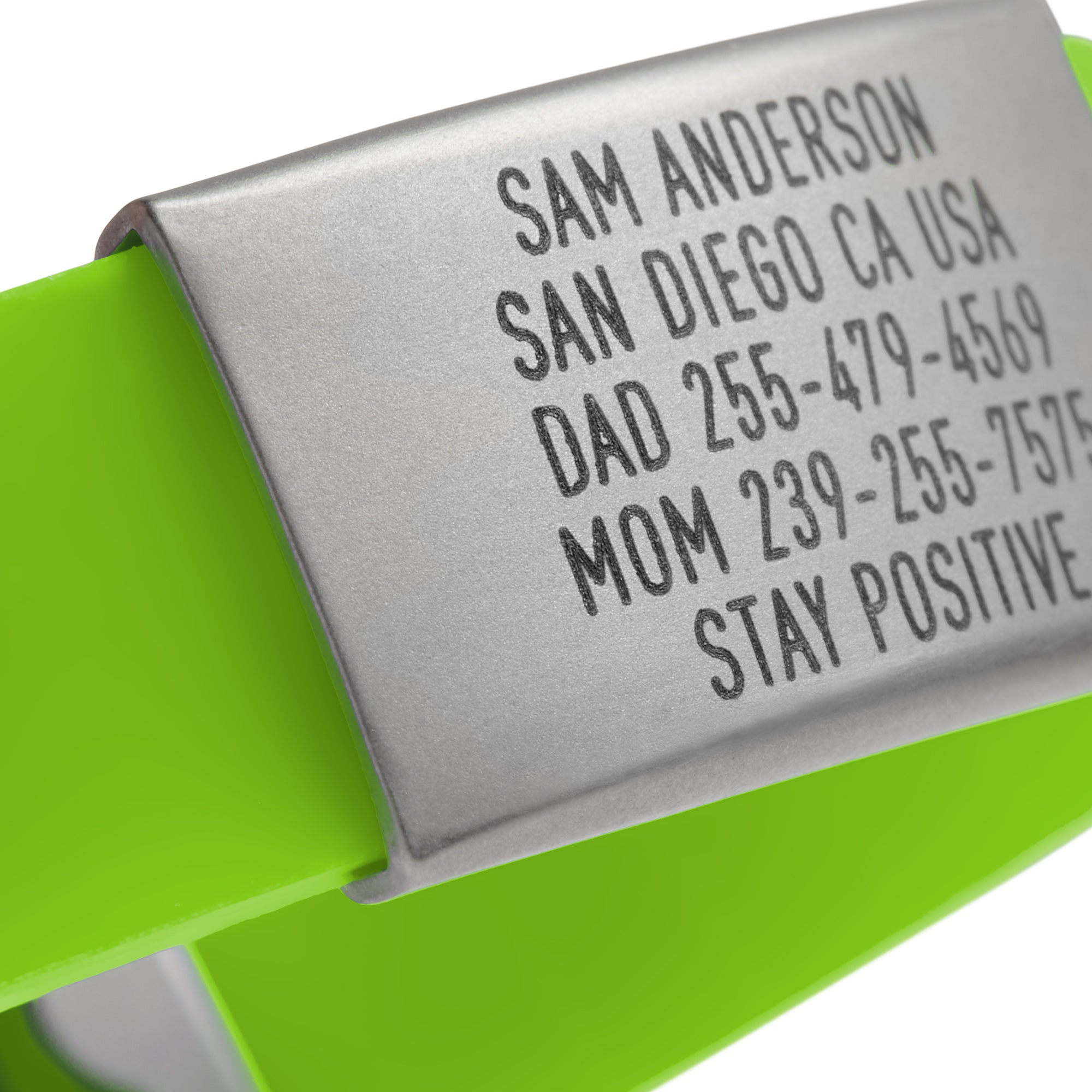 Close-up of a lime Green silicone with silver ID tag and silver matching double locking clasp wristband Pro Thin