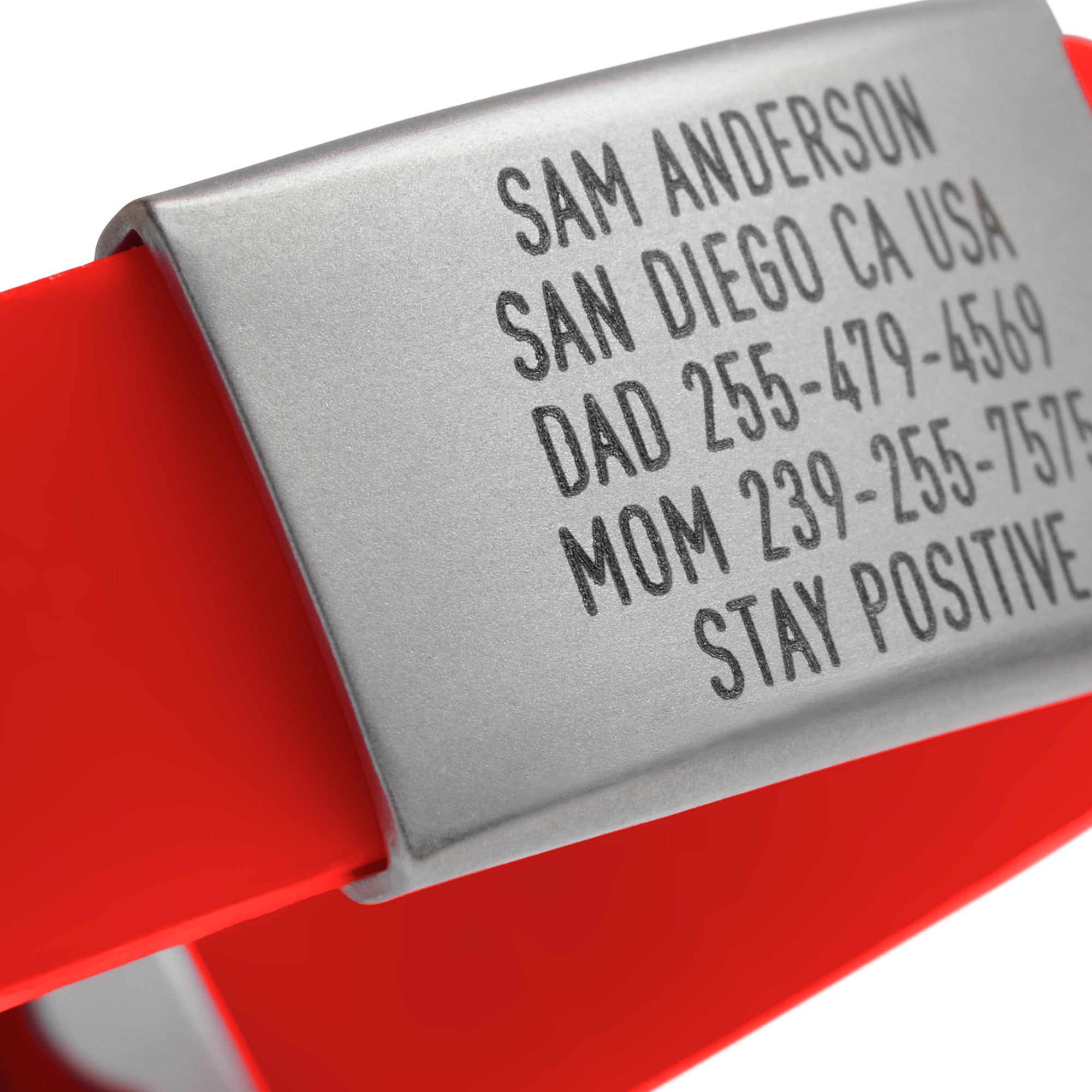 Close-up of a Red silicone with silver ID tag and silver matching double locking clasp wristband Pro Thin