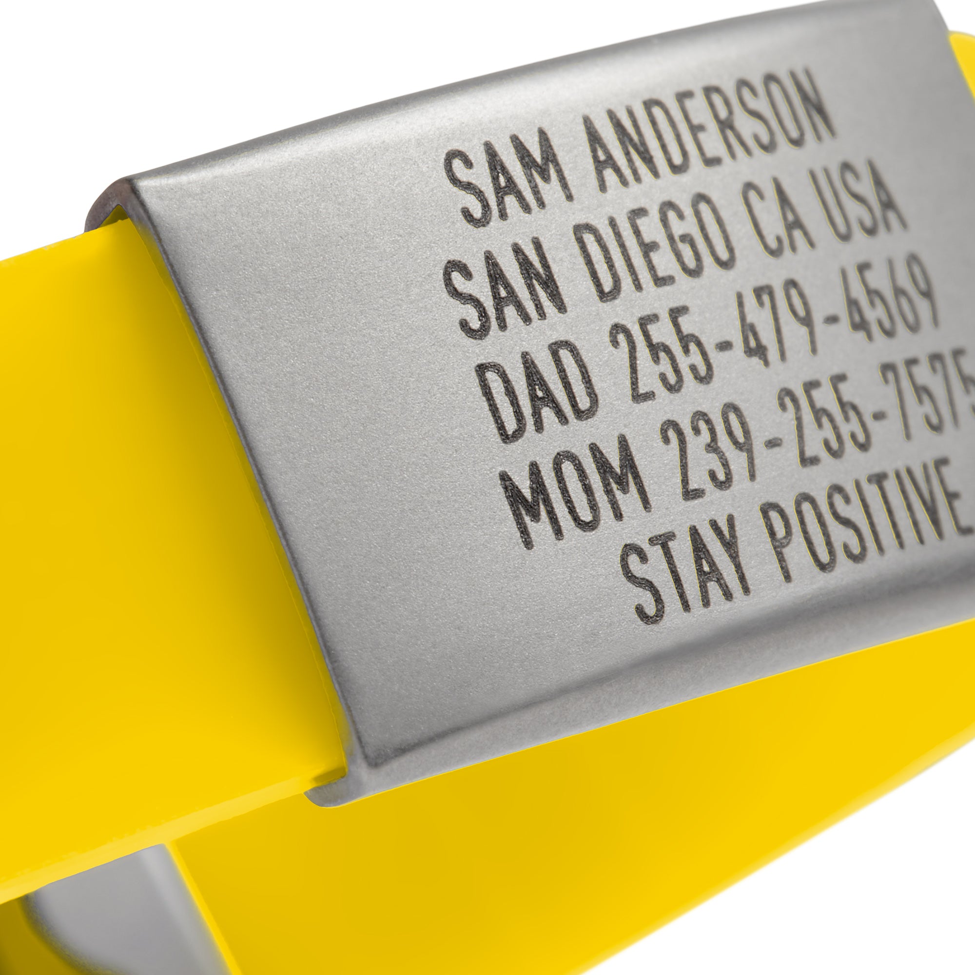 Close-up of a Yellow silicone with silver ID tag and silver matching double locking clasp wristband Pro Thin