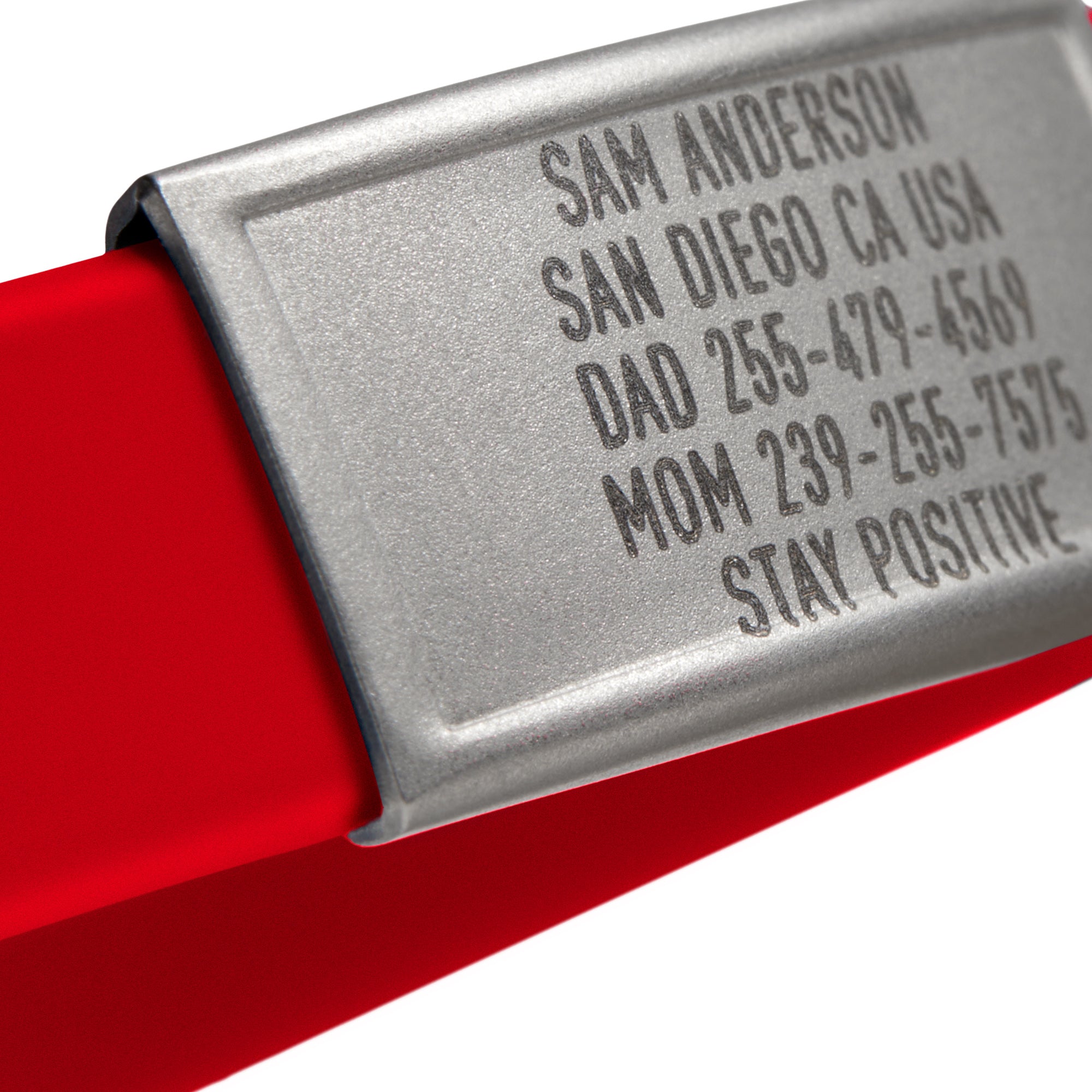 Close-up of a Red silicone with Silver ID tag Sprint wristband by BRECK iD
