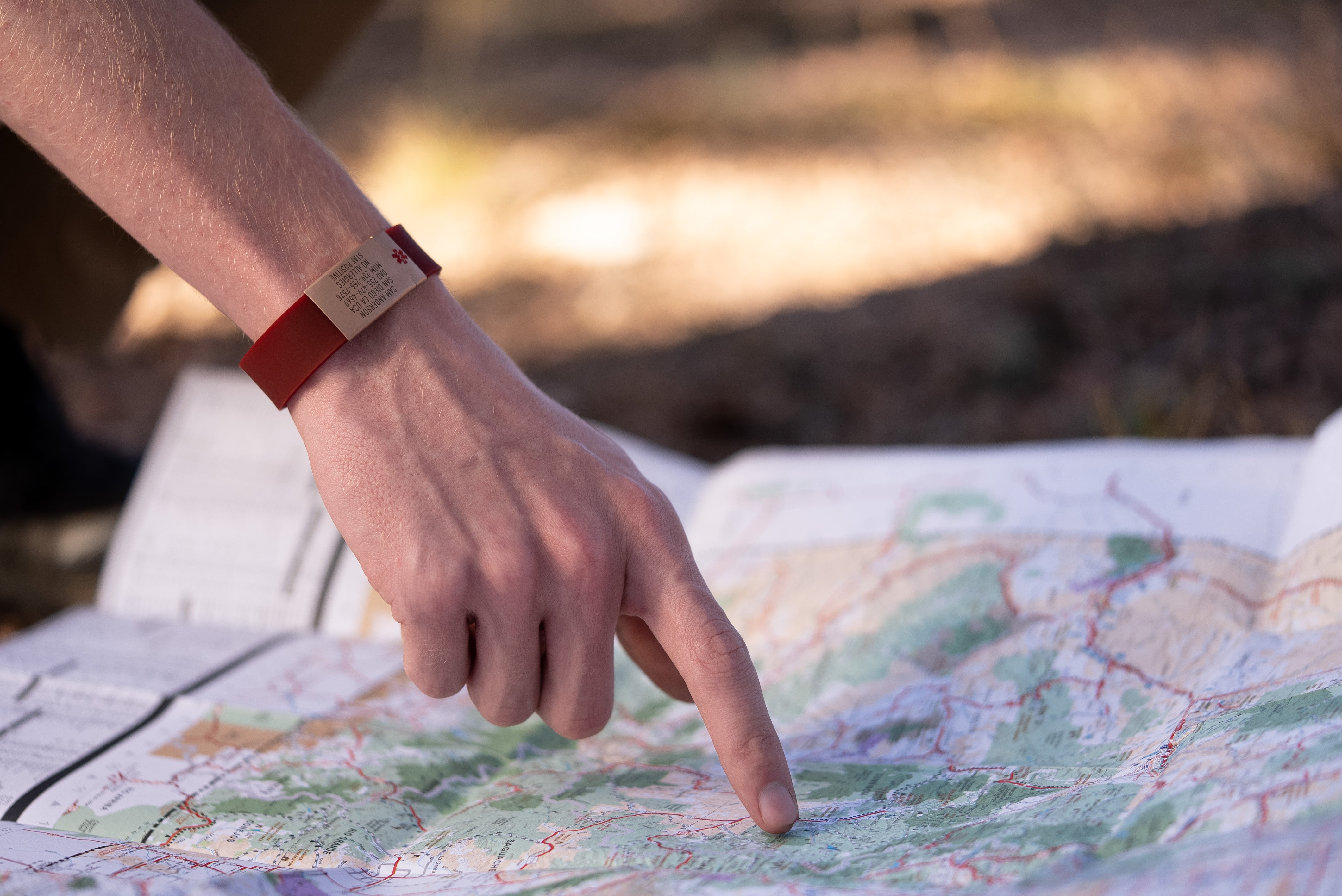 Breck iD Pro Wristband wih Maroon silicone and Gold ID tag and matching gold clasp with Medical Symbol badge.